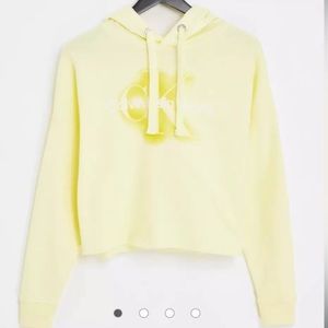Calvin Klein Jeans monogram logo raw hem cropped hoodie in lemon